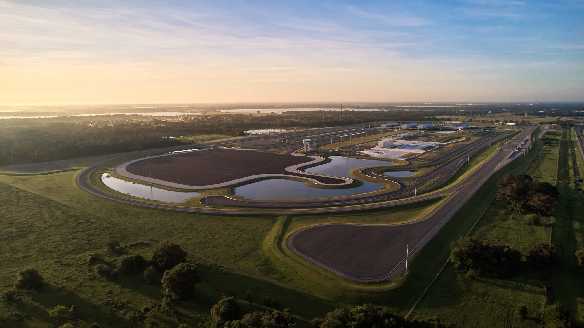 drone shot of suntrax track facility with horizon line